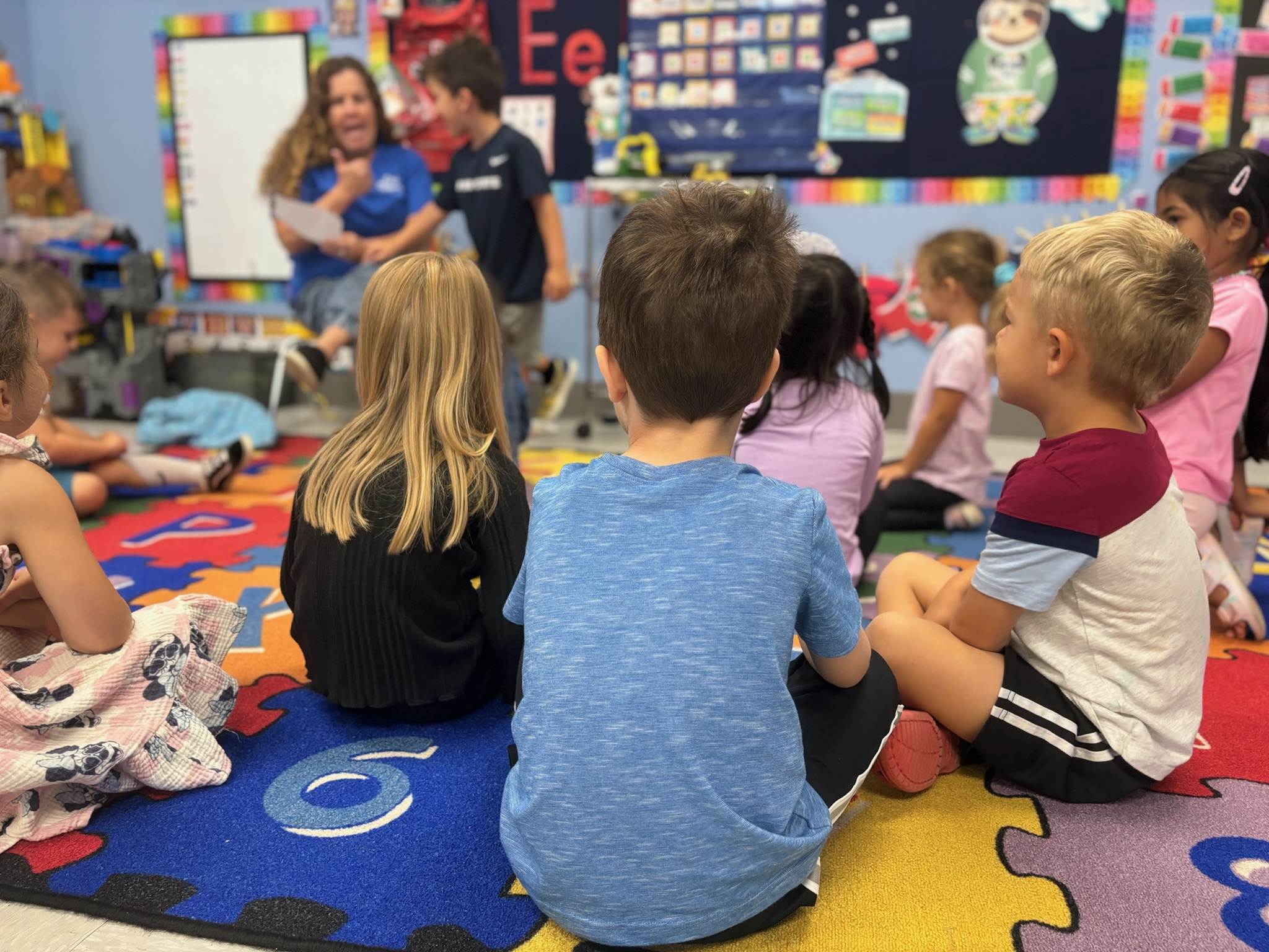 Little Sprouts classroom — children in group learning circle time